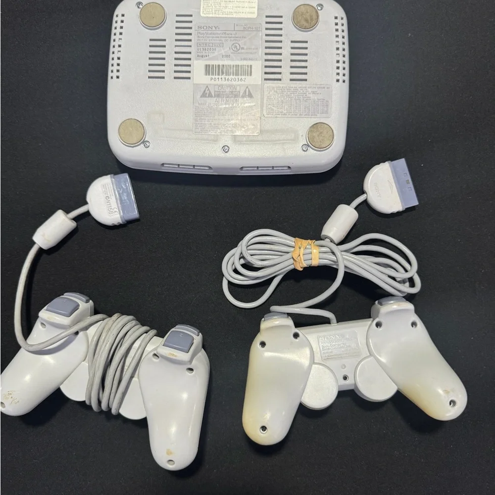 Sony PlayStation Console with Dual Gray Controllers